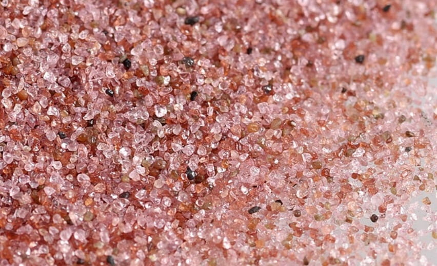 Waterjet-grade alluvial garnet after screening and preparation for consistent abrasive feeding. Waterjet-grade alluvial garnet after screening and preparation for consistent abrasive feeding.