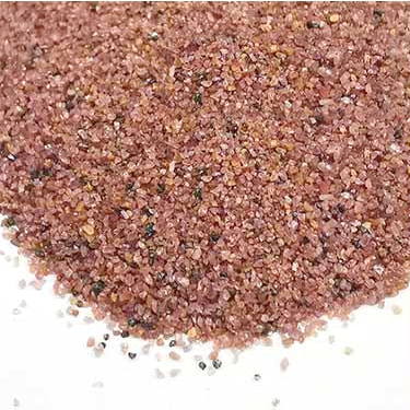 Close-up of SEPPE SGA 30/60 pink garnet abrasive grains for general blasting and surface preparation